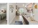 Inviting hallway leads to a bright living area, complemented by tasteful decor at 16848 Cayo Key Dr, Port Charlotte, FL 33953