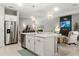 Open kitchen with a view into the living room, stainless steel appliances, and pendant lighting at 16848 Cayo Key Dr, Port Charlotte, FL 33953