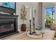 Cozy living room details with a fireplace, decorative plants, and ambient lighting at 16848 Cayo Key Dr, Port Charlotte, FL 33953