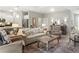 Spacious living area with open floor plan, light colored sofa and chairs, and decorative accents at 16848 Cayo Key Dr, Port Charlotte, FL 33953
