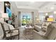Bright living room with comfortable seating and sliding glass doors to the backyard at 16848 Cayo Key Dr, Port Charlotte, FL 33953