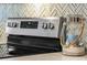 Close up on stainless steel stove and adjacent counter decorations at 16848 Cayo Key Dr, Port Charlotte, FL 33953
