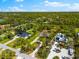 Picturesque aerial shot featuring homes surrounded by beautiful tree coverage creating a beautiful canopy at 1785 Bayshore Dr, Englewood, FL 34223