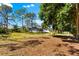 Expansive backyard with lush greenery, perfect for outdoor activities and relaxation with views of the screened in lanai at 1785 Bayshore Dr, Englewood, FL 34223