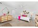 Bright bedroom featuring stylish decor, modern ceiling fan, and ample natural light at 1785 Bayshore Dr, Englewood, FL 34223