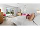 Bright bedroom with views to the pool area and neutral-toned decor at 1785 Bayshore Dr, Englewood, FL 34223