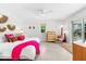 Bright bedroom with stylish decor, a comfortable bed, and access to outdoor views at 1785 Bayshore Dr, Englewood, FL 34223