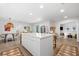 Open-concept kitchen with a large center island and adjacent dining area at 1785 Bayshore Dr, Englewood, FL 34223