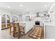 Well-designed kitchen with a large island, white cabinetry, and modern appliances at 1785 Bayshore Dr, Englewood, FL 34223