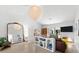 Bright living room features modern lighting, unique decor, and views into other rooms, creating an inviting atmosphere at 1785 Bayshore Dr, Englewood, FL 34223