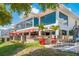 Exterior of The Waverly Restaurant & Bar showing outdoor seating and well landscaped grounds at 1785 Bayshore Dr, Englewood, FL 34223