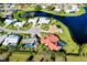 Aerial view of beautiful homes surrounding a private lake at 1886 Killdeer Ct, Venice, FL 34293
