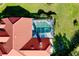 Aerial view of the home showing the pool and manicured lawn at 1886 Killdeer Ct, Venice, FL 34293