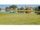 Beautiful waterfront backyard with lush green lawn at 1886 Killdeer Ct, Venice, FL 34293