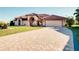 Beautiful single-Gathering home with a paver driveway and tile roof at 1886 Killdeer Ct, Venice, FL 34293