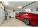 The garage has epoxy floors, lots of storage, and is big enough to hold a car and more at 1886 Killdeer Ct, Venice, FL 34293