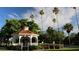 Beautiful park gazebo featuring a red tile roof and decorative white railings near lush landscaping at 1886 Killdeer Ct, Venice, FL 34293