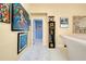 Hallway featuring artwork and a grand grandfather clock at 1886 Killdeer Ct, Venice, FL 34293