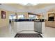 Open kitchen featuring granite countertops, stainless steel appliances, and breakfast bar seating at 1886 Killdeer Ct, Venice, FL 34293