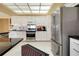 Bright kitchen featuring stainless steel appliances and sleek, modern cabinetry at 1886 Killdeer Ct, Venice, FL 34293