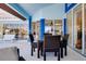 The covered lanai has a dining table and plenty of space for outdoor activities at 1886 Killdeer Ct, Venice, FL 34293
