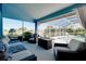 The covered lanai has both covered and screened in sections as well as comfortable outdoor seating at 1886 Killdeer Ct, Venice, FL 34293