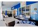 The covered lanai has plenty of room to relax with seating and a view of the outdoors at 1886 Killdeer Ct, Venice, FL 34293