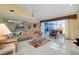 Spacious living room with sliding glass doors and tile flooring at 1886 Killdeer Ct, Venice, FL 34293