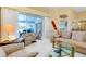 Cozy living room with sliding glass doors, comfortable seating, and unique decorations at 1886 Killdeer Ct, Venice, FL 34293