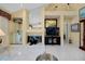 Living room with tile flooring, fireplace, and built-in entertainment center at 1886 Killdeer Ct, Venice, FL 34293