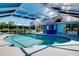 The screen in pool features plenty of space for activies and has a bar near the house at 1886 Killdeer Ct, Venice, FL 34293