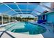 The screened in pool features an in-pool bar and has space for plenty of activities at 1886 Killdeer Ct, Venice, FL 34293