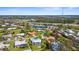 Aerial view of a lovely home with a private pool surrounded by lush green lawn in a desirable neighborhood at 201 Cavallini Dr, Nokomis, FL 34275