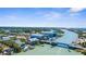 Overhead shot captures a bridge connecting coastal areas with a river, boat docks, and waterfront residences at 201 Cavallini Dr, Nokomis, FL 34275