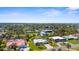 An aerial view showcases the location of the home and the surrounding neighborhood at 201 Cavallini Dr, Nokomis, FL 34275
