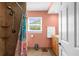 Full bathroom with shower, ceramic tile floors, window, and white towel, enhancing the bathroom's comfort and appeal at 201 Cavallini Dr, Nokomis, FL 34275