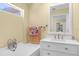 Bright bathroom featuring a combination tub and shower, and a large vanity at 201 Cavallini Dr, Nokomis, FL 34275