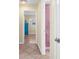 Bright hallway showing bedroom and bathroom entrances at 201 Cavallini Dr, Nokomis, FL 34275