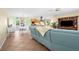 Open-concept living space with tile floors flowing into the dining and kitchen areas at 201 Cavallini Dr, Nokomis, FL 34275