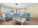 Spacious living room showcasing a sectional sofa and large windows for plenty of light at 201 Cavallini Dr, Nokomis, FL 34275