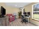 Bright office space with wood-look floors, a ceiling fan, and natural light at 201 Cavallini Dr, Nokomis, FL 34275
