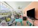 Screened-in patio with ample seating and entertainment area at 201 Cavallini Dr, Nokomis, FL 34275