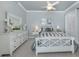 Comfortable main bedroom showcasing a white bed frame, plush pillows, and ample natural light at 206 Bella Vista Ter # 29A, Nokomis, FL 34275