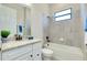 Inviting bathroom with granite countertop, tiled shower and tub, and a neutral color scheme at 20794 Valprato Ct, Venice, FL 34293