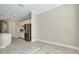 An open kitchen and dining area with stainless steel appliances and tile flooring at 20794 Valprato Ct, Venice, FL 34293