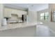Kitchen with granite countertops, stainless steel appliances, and tile flooring at 20794 Valprato Ct, Venice, FL 34293
