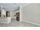 An open kitchen area featuring stainless steel appliances and tile flooring at 20794 Valprato Ct, Venice, FL 34293