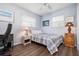 Cozy bedroom with a bed, two windows and a desk, perfect for relaxation or study at 308 Purdue Rd, Venice, FL 34293
