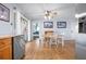 Bright dining area with wood floors and natural light coming from the glass door at 308 Purdue Rd, Venice, FL 34293