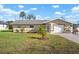 Charming single-story home showcases manicured front yard with lush lawn and vibrant landscaping at 308 Purdue Rd, Venice, FL 34293